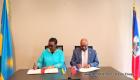 Haiti and Rwanda diplomats signing a joint communiqué