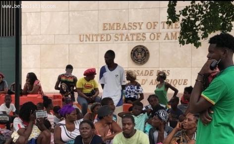 Photo of Haitians seeking refuge at the US Embassy  running from gang violence