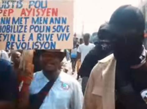 Rosemond Jean leading a street protest in Petion-Ville Haiti