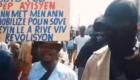 Rosemond Jean leading a street protest in Petion-Ville Haiti